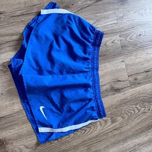 Blue Nike running shorts